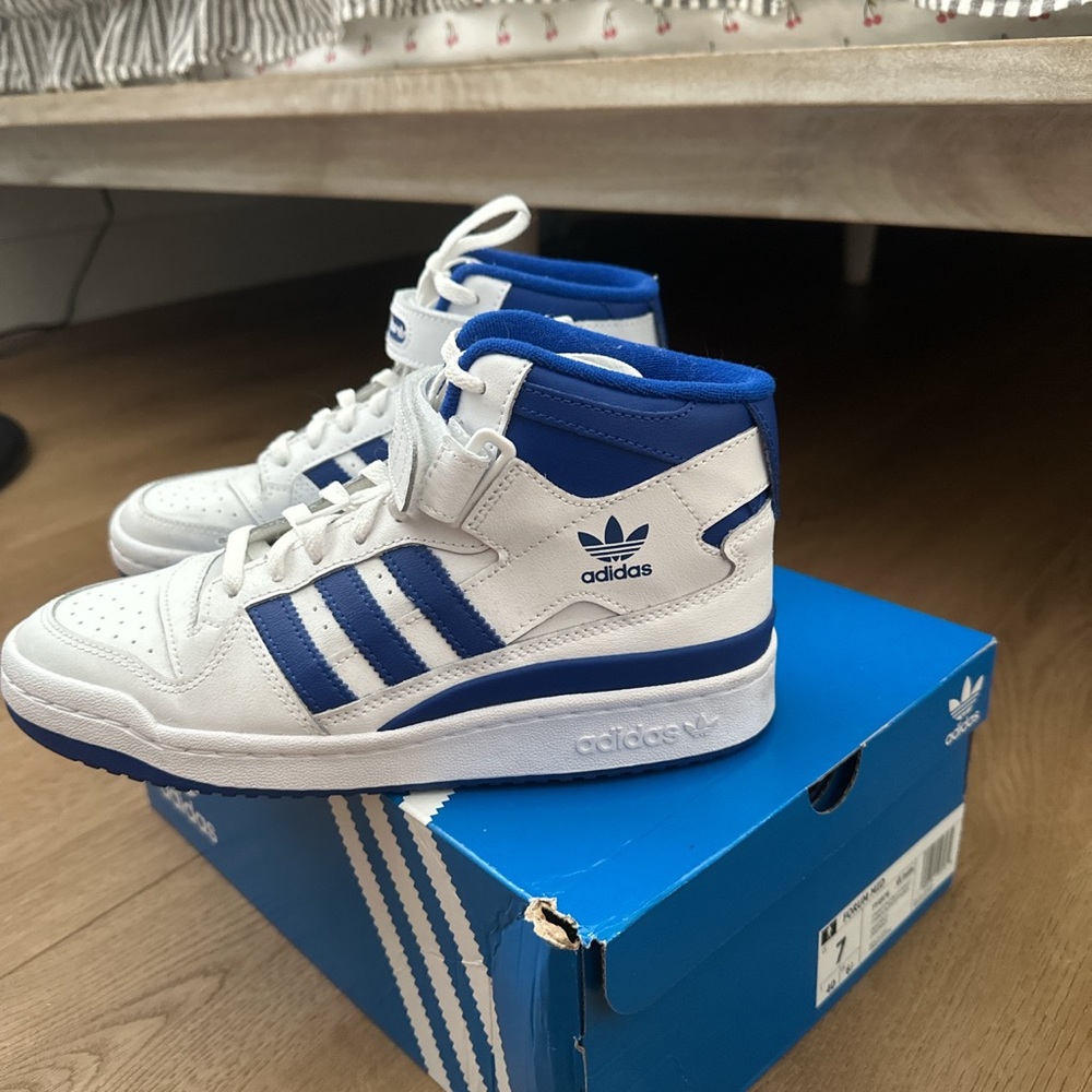 ADIDAS FORUM MID SHOES. color blue size 8.5 women’s and size 7 in men’s